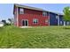 Red two-story house with green grass and a sliding glass door at 1351 Byron St, Greenfield, IN 46140