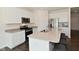 Modern kitchen featuring stainless steel appliances, granite countertops, and island seating at 1351 Byron St, Greenfield, IN 46140