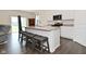 Modern kitchen featuring stainless steel appliances, granite countertops, and breakfast bar seating at 1351 Byron St, Greenfield, IN 46140