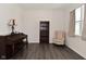 Bright living room features hardwood floors and a cozy reading nook by the window at 1351 Byron St, Greenfield, IN 46140