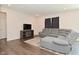 Cozy living room featuring a sectional sofa, modern entertainment center, and neutral decor at 1351 Byron St, Greenfield, IN 46140