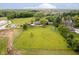 Aerial view of a private property with a large grassy lawn, mature trees, and a charming gazebo at 16714 Oak Rd, Westfield, IN 46074