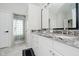 Elegant bathroom featuring double vanity, granite countertops, framed mirror, and glass shower at 16714 Oak Rd, Westfield, IN 46074
