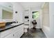 Bathroom with sink, dark countertops, decorative accents, and shower-tub with decorative curtain at 16714 Oak Rd, Westfield, IN 46074