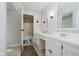 Bathroom with double vanity, framed mirror, and view into separate toilet and bath at 16714 Oak Rd, Westfield, IN 46074