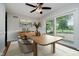 Bright dining room with a sleek table and chairs, modern decor, and views of the outdoor gazebo at 16714 Oak Rd, Westfield, IN 46074