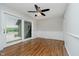 Bright dining area with sliding doors, wood floors, and a modern ceiling fan at 16714 Oak Rd, Westfield, IN 46074