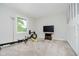 Home gym features rowing machine, dumbbells, and a TV for an active lifestyle at 16714 Oak Rd, Westfield, IN 46074
