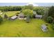Beautifully landscaped home featuring a large yard, charming gazebo, and outbuilding and three-car garage at 16714 Oak Rd, Westfield, IN 46074