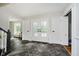 Spacious foyer boasts beautiful dark-tiled flooring and elegant glass-paneled doors allowing light to fill the space at 16714 Oak Rd, Westfield, IN 46074