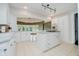 Bright kitchen with white cabinets, an island cooktop, and stainless steel appliances at 16714 Oak Rd, Westfield, IN 46074