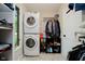 Well-organized laundry room with washer, dryer, storage shelves, and natural light from window at 16714 Oak Rd, Westfield, IN 46074