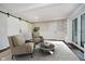 Bright living room featuring modern furnishings, barn doors, and access to outdoor spaces at 16714 Oak Rd, Westfield, IN 46074