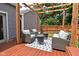 Backyard deck featuring seating under pergola at 1702 Kessler Blvd E Dr, Indianapolis, IN 46220