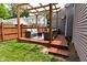 Backyard deck featuring seating and pergola at 1702 Kessler Blvd E Dr, Indianapolis, IN 46220
