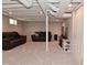 Finished basement with carpet, exposed ceiling, and comfortable seating area for relaxation and entertainment at 1702 Kessler Blvd E Dr, Indianapolis, IN 46220