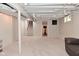 Spacious finished basement featuring carpet, stairs and workout equipment area at 1702 Kessler Blvd E Dr, Indianapolis, IN 46220
