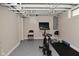 Basement workout area with exercise equipment and durable flooring, with natural light at 1702 Kessler Blvd E Dr, Indianapolis, IN 46220