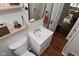 Updated bathroom features a modern vanity, mirror, and stylish decor at 1702 Kessler Blvd E Dr, Indianapolis, IN 46220