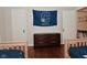 Bedroom with twin beds, hardwood floors, and a dresser at 1702 Kessler Blvd E Dr, Indianapolis, IN 46220