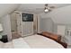 Bright bedroom with neutral color walls, television, and trunk used as decor at 1702 Kessler Blvd E Dr, Indianapolis, IN 46220