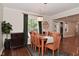 Well-lit dining area with hardwood floors, wooden table, and seating at 1702 Kessler Blvd E Dr, Indianapolis, IN 46220