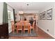 Dining room with wood table, matching chairs, and hardwood floors at 1702 Kessler Blvd E Dr, Indianapolis, IN 46220