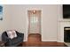 Inviting hallway with hardwood floors leads to the front door at 1702 Kessler Blvd E Dr, Indianapolis, IN 46220