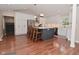 A well lit modern kitchen with a contrasting island and stainless steel appliances at 1702 Kessler Blvd E Dr, Indianapolis, IN 46220