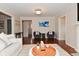 Open living room with seating, decorative art, and wood floors at 1702 Kessler Blvd E Dr, Indianapolis, IN 46220