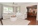 Bright living room featuring a large sectional sofa and hardwood floors at 1702 Kessler Blvd E Dr, Indianapolis, IN 46220