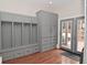 Mudroom area complete with custom lockers and built in storage and access to outside deck at 1702 Kessler Blvd E Dr, Indianapolis, IN 46220