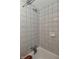 Tiled shower with shower head and fixtures at 1702 Kessler Blvd E Dr, Indianapolis, IN 46220