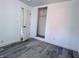 An empty bedroom features an alcove closet and light-colored vinyl plank flooring at 1818 Broadway St, Anderson, IN 46012