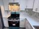 Clean kitchen featuring stainless steel oven and marble countertops at 1818 Broadway St, Anderson, IN 46012