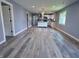 Spacious open-concept living room features hardwood flooring, recessed lighting, and an airy atmosphere at 1818 Broadway St, Anderson, IN 46012