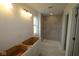 Modern bathroom with a tiled shower, vanity space, and bright lighting, awaiting finishing touches at 1890 Victor Higgins Dr, Shelbyville, IN 46176