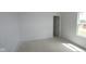 Light bedroom with a window, doorway, and neutral walls, ready for personal touches and design at 1890 Victor Higgins Dr, Shelbyville, IN 46176