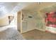 Unfinished attic space with sloped ceilings, built-in shelving and vintage decor at 1904 N Bosart Ave, Indianapolis, IN 46218