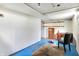Spacious basement area with concrete walls, chair, and desk at 1904 N Bosart Ave, Indianapolis, IN 46218