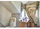 Small bathroom with toilet, vanity, mirror and an angled ceiling at 1904 N Bosart Ave, Indianapolis, IN 46218