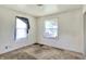Simple bedroom with two windows and wall-mounted electrical outlets at 1904 N Bosart Ave, Indianapolis, IN 46218