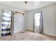 Bedroom with gray walls, windows with curtains, and an unadorned shelf at 1904 N Bosart Ave, Indianapolis, IN 46218