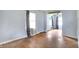 Bright living room with hardwood floors, showing natural light and an open doorway at 1904 N Bosart Ave, Indianapolis, IN 46218