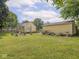 Wide shot of the backyard, showing the patio and detached garage at 2018 N Rochester Ave, Indianapolis, IN 46222