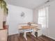 A bright dining room features a built-in banquette and a modern white motif at 2018 N Rochester Ave, Indianapolis, IN 46222
