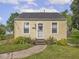 Picture of the front of a well maintained home with sidewalk and decorative landscaping at 2018 N Rochester Ave, Indianapolis, IN 46222