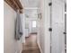 Hallway leading to the kitchen area with hardwood flooring at 2018 N Rochester Ave, Indianapolis, IN 46222