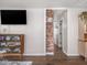 Stylish living area with modern entertainment center and hardwood floors at 2018 N Rochester Ave, Indianapolis, IN 46222