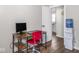 Home office with a desk, monitor and a water cooler with a small refrigerator at 2018 N Rochester Ave, Indianapolis, IN 46222